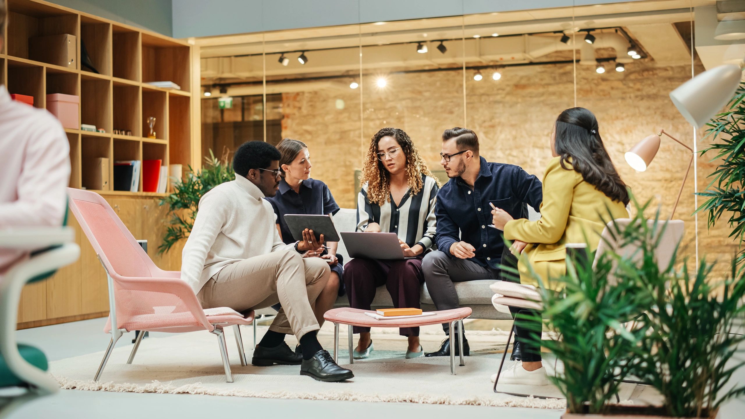 Creative agency team discussing ideas in a modern meeting room