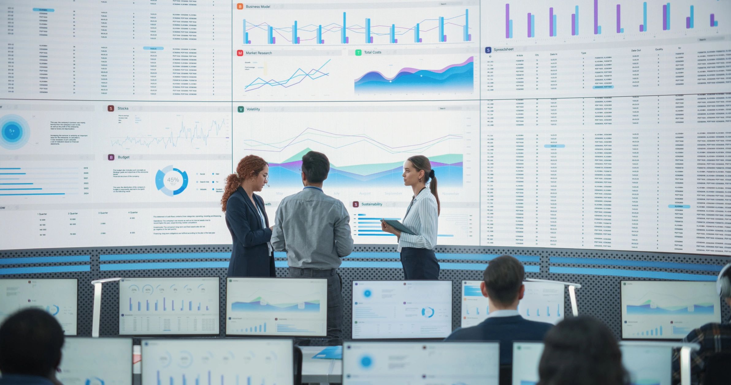 Team reviewing analytics dashboards in a modern office