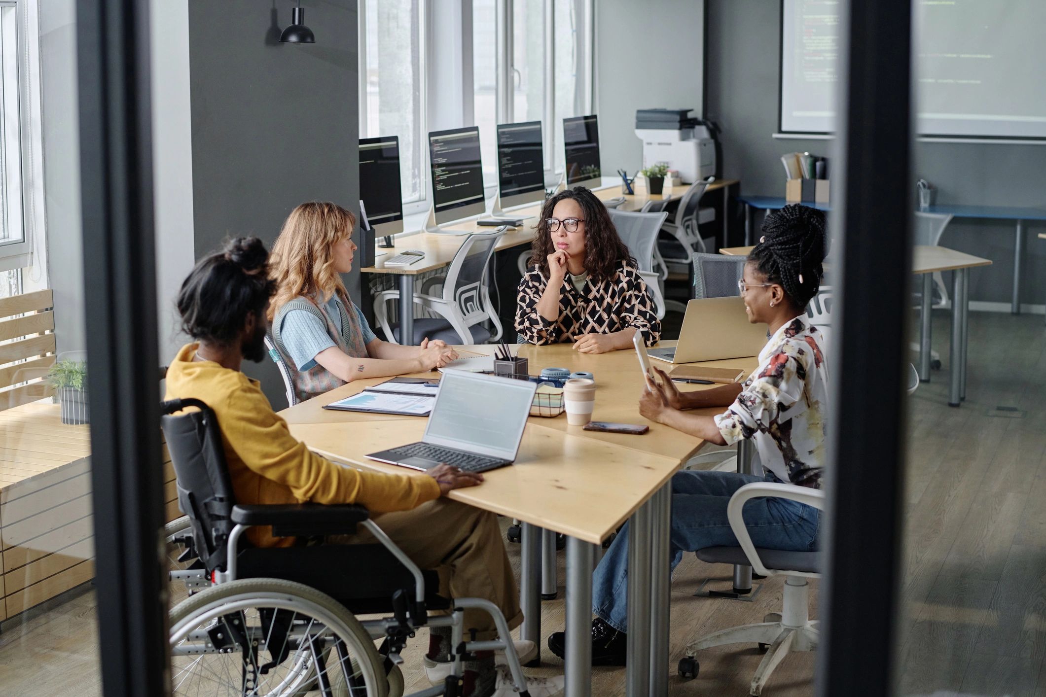 Marketing and development team meeting in a modern office