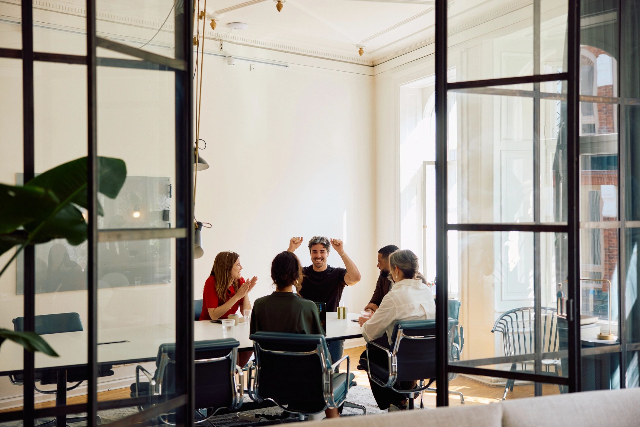 Business professionals brainstorming together in a modern office
