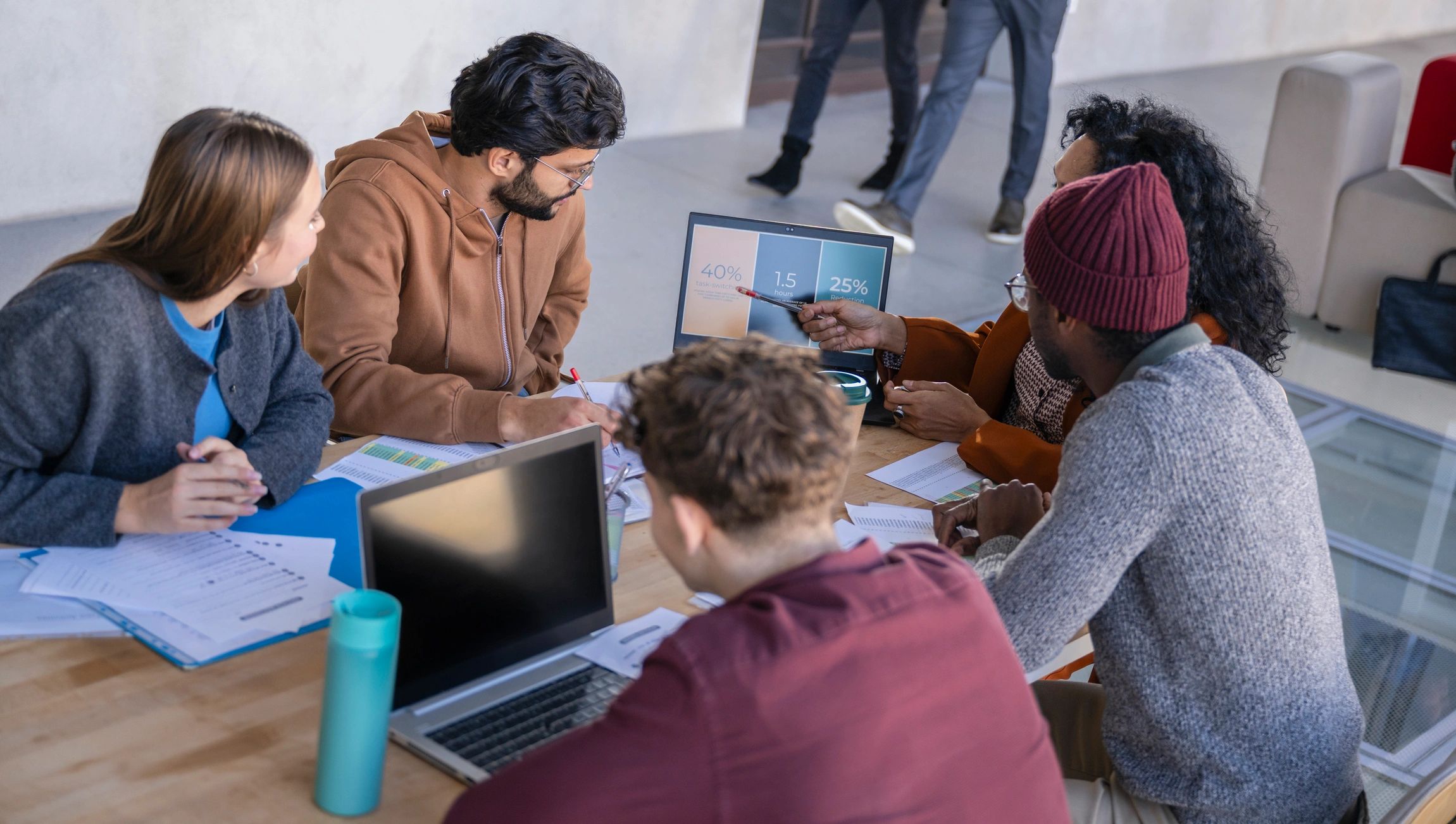 Startup team collaborating around a table in a creative workspace