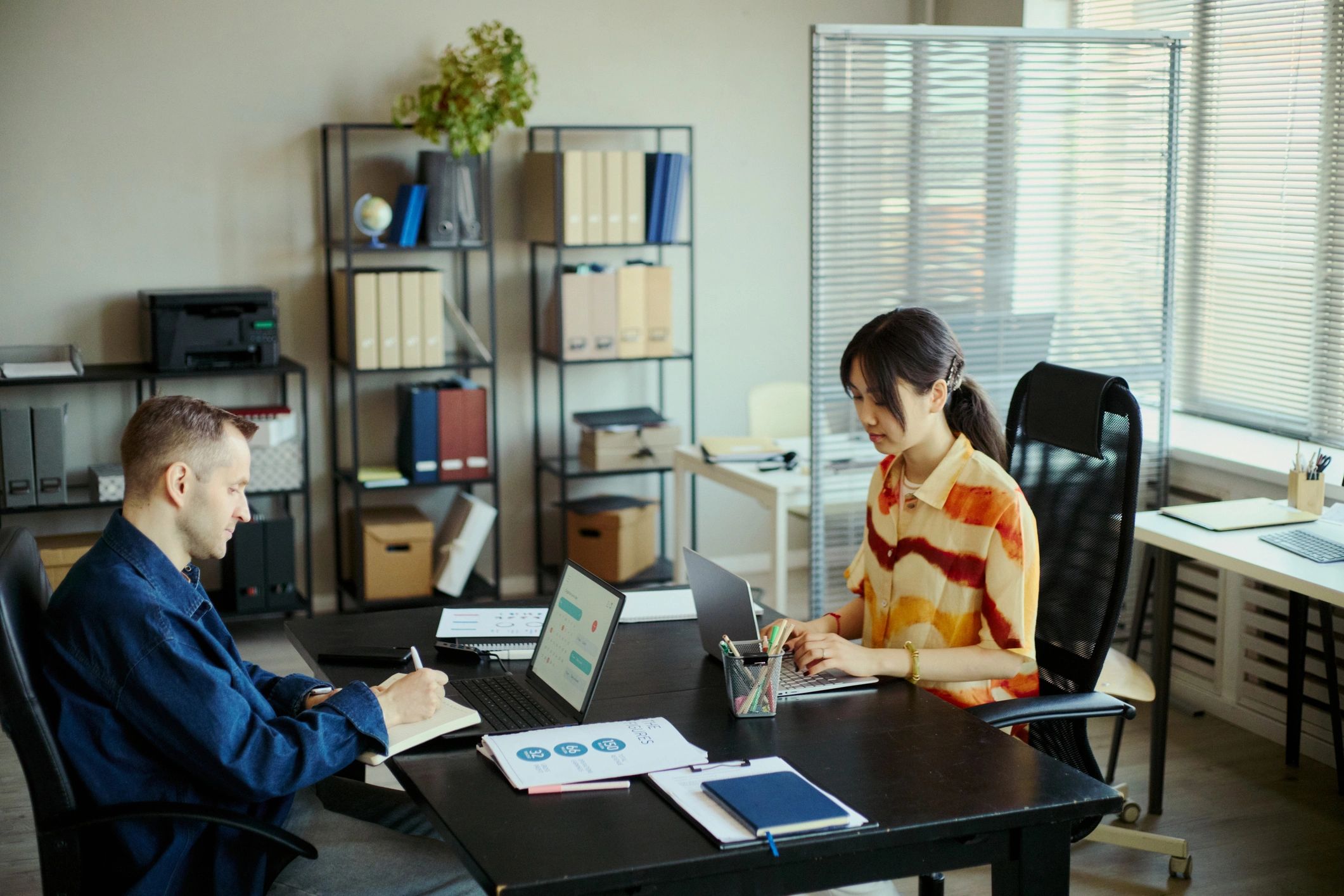 Adult Business Team Working in Office on Project Planning